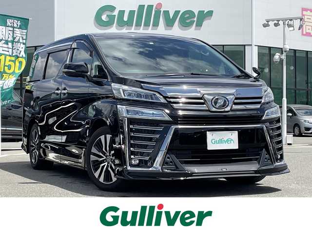 トヨタ ヴェルファイア Z Gエディション 佐賀県 2019(令1)年 9.3万km ブラック 純正10型SDナビ(フルセグTV/CD/DVD/BT)/バックカメラ/TRDエアロ/ツインムーンルーフ/トヨタセーフティーセンス/両側パワースライドドア/コーナーセンサー/レーダークルーズコントロール/パワーシート/シートヒーター/エアシート/ハンドルヒーター/オットマン/3眼LEDヘッドライト/シーケンシャルウィンカー/ドラレコ/スマートキー×2/ETC/100V電源/電子パーキング/オートホールド/純正フロアマット/純正18インチアルミホイール