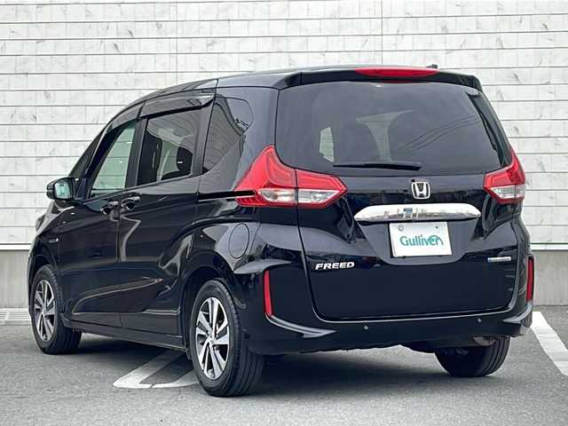 ホンダ フリード ハイブリット G ホンダセンシング 山形県 2021(令3)年 3.7万km クリスタルブラックパール 禁煙車/Honda SENSING/・衝突軽減ブレーキ（ＣＭＢＳ）/・路外逸脱抑制機能/・先行車発進お知らせ機能/・アダプティブクルーズコントロール（ＡＣＣ）/・車線維持支援システム（ＬＫＡＳ）/・標識認識機能/・誤発進抑制機能 /ハーフレザーシート/両側パワースライドドア/純正ナビ(CD.DVD.SD.BT.USB)/バックカメラ/フルセグ/ビルトインETC/LEDヘッドライト/ワイパーデアイサー/ロールアップサンシェード/プッシュスタート/スマートキー