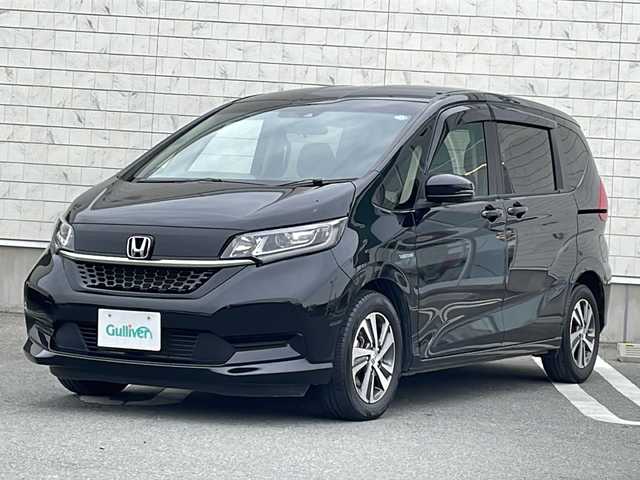 ホンダ フリード ハイブリット G ホンダセンシング 山形県 2021(令3)年 3.7万km クリスタルブラックパール 禁煙車/Honda SENSING/・衝突軽減ブレーキ（ＣＭＢＳ）/・路外逸脱抑制機能/・先行車発進お知らせ機能/・アダプティブクルーズコントロール（ＡＣＣ）/・車線維持支援システム（ＬＫＡＳ）/・標識認識機能/・誤発進抑制機能 /ハーフレザーシート/両側パワースライドドア/純正ナビ(CD.DVD.SD.BT.USB)/バックカメラ/フルセグ/ビルトインETC/LEDヘッドライト/ワイパーデアイサー/ロールアップサンシェード/プッシュスタート/スマートキー