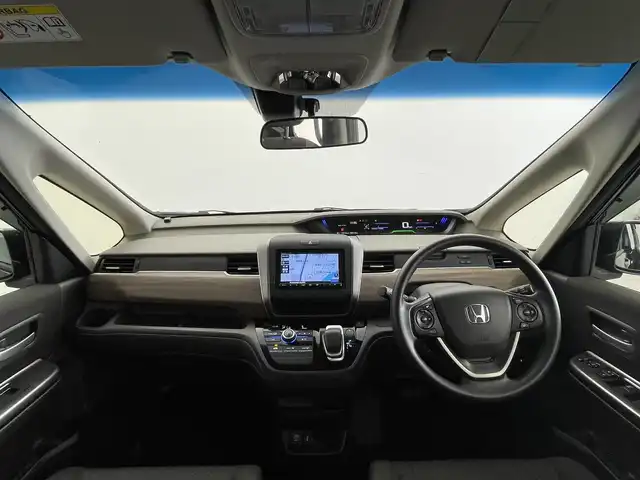 ホンダ フリード ハイブリット G ホンダセンシング 群馬県 2020(令2)年 5.5万km クリスタルブラックパール 社外７インチナビ　バックカメラ　レーダークルーズコントロール　レーンキープアシスト　衝突軽減ブレーキ　両側パワースライドドア　ＬＥＤヘッドライト　オートライト　ビルトインＥＴＣ　コーナーセンサー