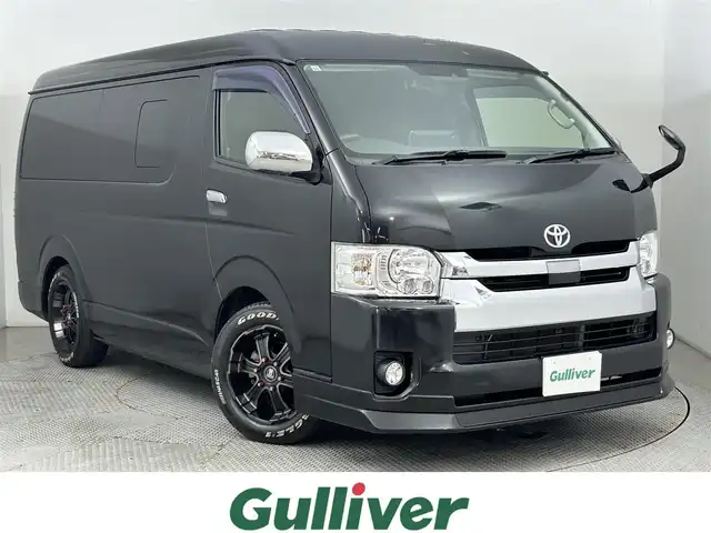 トヨタ ハイエース GL 道央・札幌 2019(令1)年 5.3万km ブラックマイカ ・ワンオーナー/・４WD/・寒冷地仕様/・FLEX仕様/・ALPINE11インチフローディングナビ/　CD/DVD/SD/BT/フルセグ/・ALPINEフリップダウンモニター/・バックカメラ/・ビルトインETC/・衝突軽減ブレーキ/・レーンアシスト/・オートハイビーム/・BARBERO17インチAW/・415コブラ製ステアリング/・415コブラ製内装パネル/・415コブラ製LEDテールレンズ/・Valenti製ハイマウント/・ナスカホワイトレタータイヤ/・FLEX製シートカバー、フロアマット/・FLEX製ベッドキット、テーブルフロア加工/・リアヒーター＆クーラー/・プッシュスタート/・スマートキー/・新車時保証書/・取扱説明書