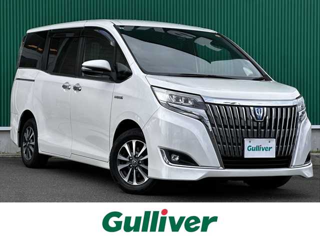 トヨタ エスクァイア ハイブリッド Gi 宮城県 2017(平29)年 10.5万km ホワイトパールクリスタルシャイン Toyota Safety Sense/純正10型ナビ/【CD・DVD・SD・BT・フルセグTV】/バックカメラ/両側パワースライドドア/純正フリップダウンモニター/ブラック合皮シート/シートヒーター/シートリフター/クルーズコントロール/リアサンシェード/プリクラッシュセーフティ/レーンディパーチャートアラート/先行発進告知/オートハイビーム/オートライト/LEDヘッドライト/フォグライト/ウッドコンビステアリング/リアサンシェード/スマートキー/ETC