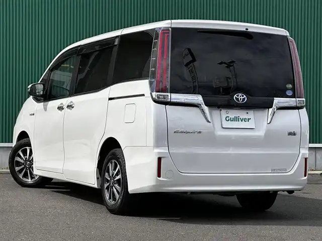 トヨタ エスクァイア ハイブリッド Gi 宮城県 2017(平29)年 10.5万km ホワイトパールクリスタルシャイン Toyota Safety Sense/純正10型ナビ/【CD・DVD・SD・BT・フルセグTV】/バックカメラ/両側パワースライドドア/純正フリップダウンモニター/ブラック合皮シート/シートヒーター/シートリフター/クルーズコントロール/リアサンシェード/プリクラッシュセーフティ/レーンディパーチャートアラート/先行発進告知/オートハイビーム/オートライト/LEDヘッドライト/フォグライト/ウッドコンビステアリング/リアサンシェード/スマートキー/ETC