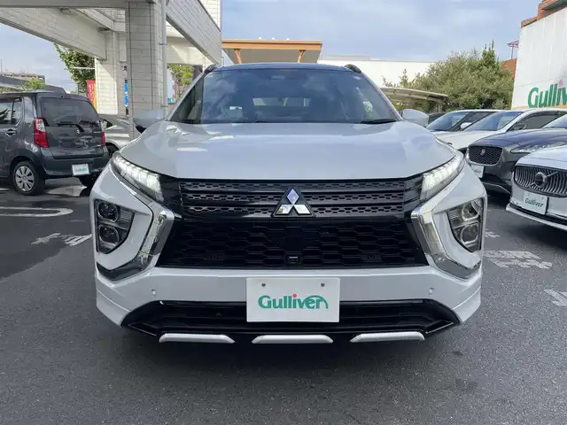 三菱 エクリプス クロス ＰＨＥＶ P 東京都 2021(令3)年 4.4万km パール ワンオーナー/e-アシスト（衝突回避パッケージ）/純正SDナビ フルセグTV/全周囲カメラ　バックカメラ/サンルーフ/ブラックハーフレザーシート/シートヒーター（前席）/パワーシート（D席）/ステアリングヒーター/ヘッドアップディスプレイ/レーダークルーズコントロール/車線逸脱警報システム/誤発進抑制機能/後側方車両検知システム/後退時車両検知システム/パドルシフト/AC1500Wコンセント/スペアキー/保証書＆取扱説明書