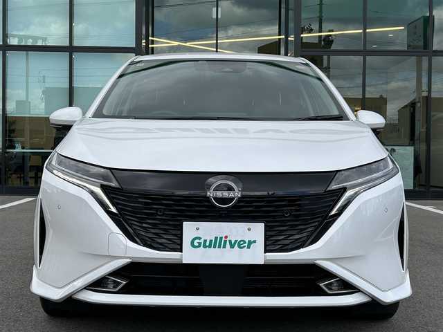 日産 オーラ G レザーエディション 愛媛県 2022(令4)年 4万km ピュアホワイトパール 登録時走行距離：39471km/BOSEスピーカー/メーカーOP純正ナビ/AM/FM/BT/フルセグTV//AppleCarPlay/AndroidAuto/HDMI/USB/ETC2.0/全方位カメラ/前方ドラレコ/追従クルコン/衝突軽減システム/LEDヘッドライト/オートライト/オートハイビーム/エンジンスタートボタン/スマートキー/純正アルミホイール/純正フロアマット/前後コーナーセンサー