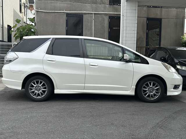 ホンダ フィット シャトル ハイブリッド 京都府 2012(平24)年 11.2万km プレミアムホワイトパール 純正ナビＶＸＭ－１２８ＶＳ　/ＣＤ／ＤＶＤ／ＴＶ／ＵＳＢ　/バックカメラ　/ハーフレザーシート　/ドライブレコーダー　/ＥＴＣ　/社外１５ＡＷ　/キーレスキー　/スペアキー　/電格ミラー　/ＡＢＳ　/保証書　/取説