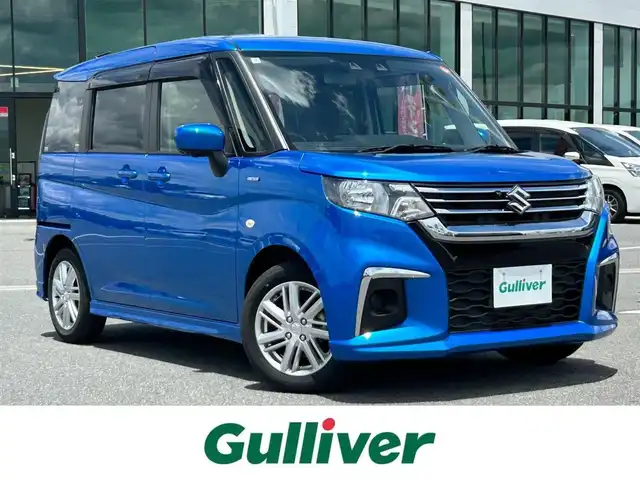 スズキ ソリオ HV MX 奈良県 2022(令4)年 0.5万km スピーディーブルーM 9インチ純正ナビ /全方位カメラ /片側パワースライドドア /フルセグTV /ビルトインETC /レーダークルーズコントロール /前席シートヒーター /LEDヘッドライト /衝突被害軽減システム /リアサンシェード