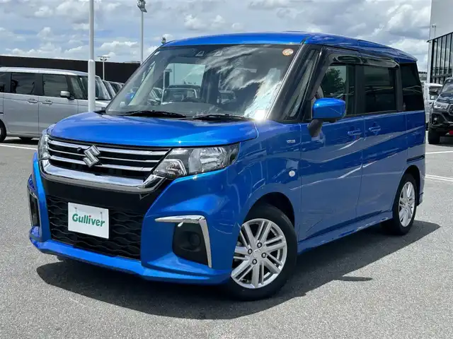 スズキ ソリオ HV MX 奈良県 2022(令4)年 0.5万km スピーディーブルーM 9インチ純正ナビ /全方位カメラ /片側パワースライドドア /フルセグTV /ビルトインETC /レーダークルーズコントロール /前席シートヒーター /LEDヘッドライト /衝突被害軽減システム /リアサンシェード