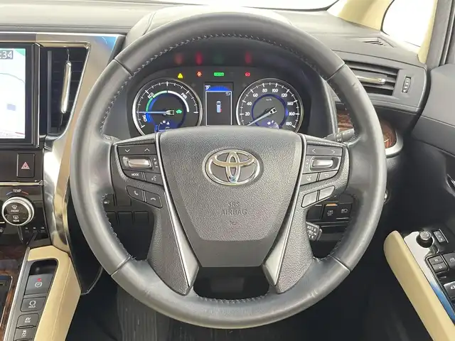 トヨタ アルファードハイブリット X 千葉県 2019(令1)年 5.8万km ホワイトパールクリスタルシャイン 禁煙車/モデリスタエアロ（F/S/R）/純正１０型ナビ（NSZN-Z68T）/AM＆FM＆Bluetooth＆フルセグTV＆CD＆DVD/両側電動スライドドア　/トヨタセーフティセンス　/プリクラッシュセーフティ/レーダークルーズコントロール　/ビルトインＥＴＣ/レザー調シートカバー（ベージュ）　/１００Ｖ電源　/純正フロアマット　/ＬＥＤヘッドライト/バックカメラ/アイドリングストップ/ウィンカーミラー/ドアバイザー/プッシュスタート