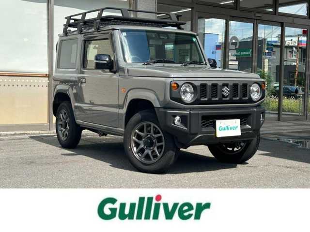 スズキ ジムニー XC 大阪府 2024(令6)年 0.6万km ミディアムグレー ワンオーナー/純正ディスプレイオーディオ/バックカメラ/レーンキープアシスト/衝突軽減システム/横滑り防止システム/クルーズコントロール/ヒーテッドミラー/シートヒーター/純正１６インチAW/ドライブレコーダー前後/ETC/保証書/取扱説明書/スペアキー