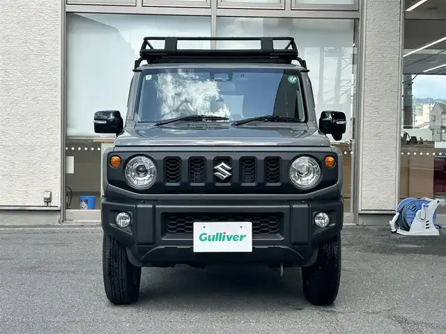 スズキ ジムニー XC 大阪府 2024(令6)年 0.6万km ミディアムグレー ワンオーナー/純正ディスプレイオーディオ/バックカメラ/レーンキープアシスト/衝突軽減システム/横滑り防止システム/クルーズコントロール/ヒーテッドミラー/シートヒーター/純正１６インチAW/ドライブレコーダー前後/ETC/保証書/取扱説明書/スペアキー