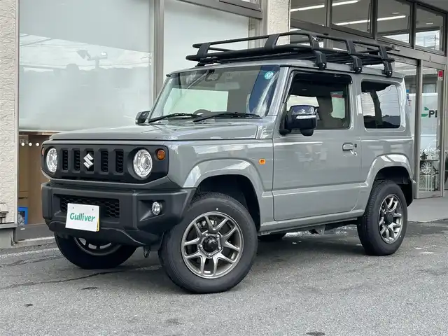 スズキ ジムニー XC 大阪府 2024(令6)年 0.6万km ミディアムグレー ワンオーナー/純正ディスプレイオーディオ/バックカメラ/レーンキープアシスト/衝突軽減システム/横滑り防止システム/クルーズコントロール/ヒーテッドミラー/シートヒーター/純正１６インチAW/ドライブレコーダー前後/ETC/保証書/取扱説明書/スペアキー