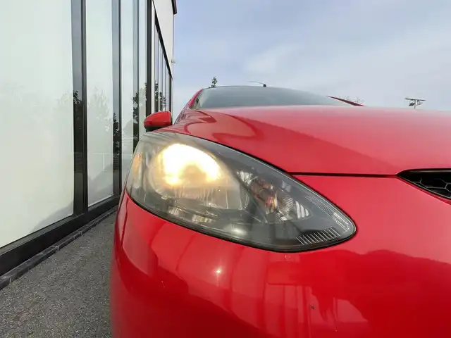 マツダ デミオ 13C－V 大阪府 2009(平21)年 7.3万km トゥルーレッド 社外ナビ/社外１４インチアルミ/オートライト/ＥＴＣ/純正マット