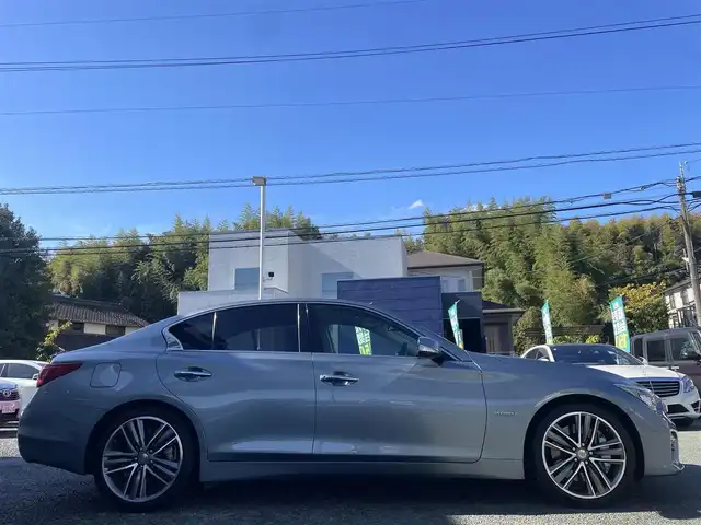 日産 スカイライン ハイブリッド 350GT Type SP 熊本県 2016(平28)年 6.2万km ハガネブルーM 純正ナビ/【フルセグTV/Bluetooth/CD/DVD】/アラウンドビューモニター/バックカメラ/レーダークルーズコントロール/純正19インチAW/黒レザーシート/パワーシート/シートヒーター/ステアリングスイッチ/パーキングセンサー/横滑り防止機能/革巻きステアリング/パドルシフト/ビルトインETC/前後ドライブレコーダー/純正フロアマット/プッシュスタート/スマートキー