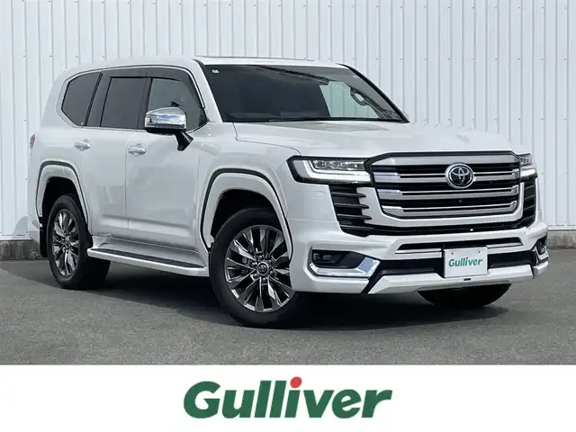 トヨタ ランドクルーザー ZX 福岡県 2024(令6)年 0.3万km プレシャスホワイトパール ワンオーナー/モデリスタエアロ/ムーンルーフ/JBLプレミアムサウンドシステム/12.3インチディスプレイオーディオPlus/フルセグTV/CD/DVD/BT/SD/AM/FM/applecarplay/androidauto/Miracast/パノラミックビューモニター/トヨタセーフティセンス/PCS/LTA/RSA/PKSB/レーダークルーズコントロール/LEDヘッドランプ/オートマチックハイビーム/BSM/クリアランスソナー/指紋認証スタートスイッチ/ハンズフリーパワーバックドア/D/Nパワーシート/快適温熱シート＆シートベンチレーション/ステアリングヒーター/電動パーキングブレーキ/ブレーキホールド/純正20インチAW/ビルトインETC2.0/アクセサリーコンセント