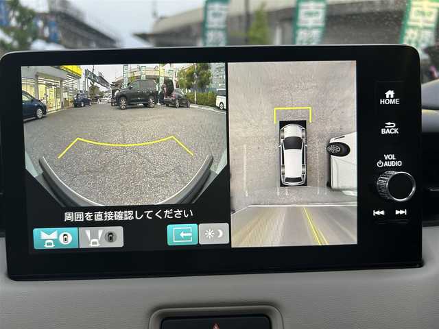 ホンダ ヴェゼル ハイブリッド e:HEV PLaY 東京都 2024(令6)年 0.4万km プレミアムサンライトホワイトパール ワンオーナー/純正メモリナビ/　フルセグTV/Bluetooth/USB端子/全方位カメラ/前後ドライブレコーダー/ビルトインETC2.0/パノラマルーフ/車線逸脱警報/トラフィックジャムパイロット/追従型クルーズコントロール/コーナーセンサー/フロントデアイサー/ブラインドスポットモニター/ダウンヒルアシストコントロール/前席シートヒーター/後席チップアップシート/LEDヘッドライト/フォグランプ/オートライト/ステアリングヒーター/ステアリングスイッチ/アイドリングストップ/スマートキー×2/電動格納ミラー/ウインカーミラー/横滑り防止装置/保証書/取扱説明書/点検記録簿
