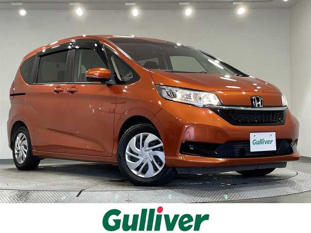 ホンダ フリード G ホンダセンシング 愛知県 2020(令2)年 1.8万km プレミアムクリスタルオレンジM 純正ナビ　/(Bluetooth/フルセグTV/AM・FM/CD・DVD再生）/両側電動スライドドア　/レーダークルーズコントロール　/衝突軽減ブレーキ　/１００Ｖ電源　/ビルトインＥＴＣ　/シートヒーター　/バックカメラ　/ドライブレコーダー　/レーンアシスト　/プッシュスタート　/後席サンバイザー/アイドリングストップ