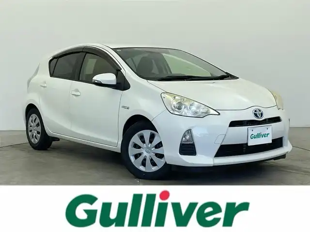 トヨタ アクア G 富山県 2013(平25)年 6万km ライムホワイトパールクリスタルシャイン 純正メモリナビ（NSCP-W62）/ワンセグ/Bluetooth/CD/バックカメラ/ETC/プッシュスタート/スマートキー×２/ウインカーミラー/革巻きステアリング/ステアリングスイッチ/ウインカーミラー/バニティミラー/ヘッドライトレベライザー/純正フロアマット/ドアバイザー