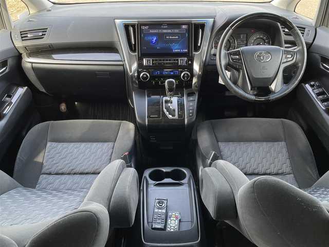 トヨタ ヴェルファイア Z 新潟県 2015(平27)年 9.2万km ホワイトパールクリスタルシャイン 4WD/社外10インチメモリナビ(EX10)/CD/DVD/BT/フルセグテレビ/バックカメラ/ETC/フリップダウンモニター/両側パワースライドドア/ステアリングスイッチ/コーナーセンサー/スマートキー/プッシュスタート/LEDヘッドライト/オートライト/フォグランプ/純正18インチアルミホイール/社外16インチAW冬タイヤ車載