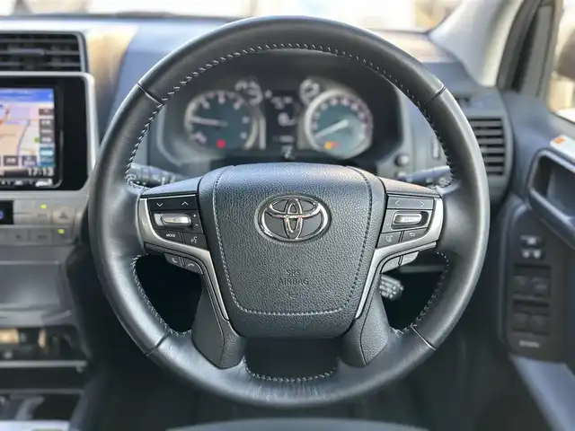 トヨタ ランドクルーザー プラド TX 東京都 2021(令3)年 2.6万km ホワイトパールクリスタルシャイン ワンオーナー/SDナビ（MDV-M907HDL）/・Bluetoothオーディオ/USBオーディオ/・フルセグTV/HDMI/DVD/電動ムーンルーフ/ブラックルーフレール/Toyota Safety Sense/・プリクラッシュセーフティ/・レーンディパーチャーアラート/・オートマチックハイビーム/・レーダークルーズコントロール/ETC/前後ドライブレコーダー/・ZDR 035/取扱説明書/保証書/スペアキー1本
