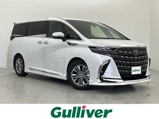 トヨタ アルファードハイブリット Z 宮城県 2024(令6)年 0.6万km プラチナホワイトパールマイカ ワンオーナー/禁煙車/モデリスタエアロ（F.S.R）/左右独立ムーンルーフ/純正13.2インチ有機EL後席モニター/パノラミックビューモニター/トヨタセーフティセンス/・プリクラッシュセーフティ/・レーントレーシングアシスト/・レーダークルーズコントロール/・ブラインドスポットモニター/・リアクロストラフィックアラート/・クリアランスソナー/純正14インチディスプレイナビ/・USB.BT.Miracast/フルセグTV/デジタルインナーミラー/AC1500W充電/両側パワースライドドア/電動リアゲート/レザーシート/・パワーシート（1/2列目）/・シートヒーター（1/2列目）/・エアシート（1/2列目）/ウッドコンビステアリングホイール/ステアリングヒーター/ビルトインETC2.0/社外ドライブレコーダー（FR）/LEDヘッドライト/LEDフォグランプ/プッシュスタート/スマートキー2個/純正18インチアルミホイール/純正フロアマット