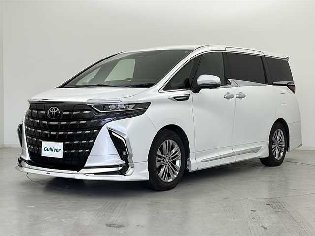 トヨタ アルファードハイブリット Z 宮城県 2024(令6)年 0.6万km プラチナホワイトパールマイカ ワンオーナー/禁煙車/モデリスタエアロ（F.S.R）/左右独立ムーンルーフ/純正13.2インチ有機EL後席モニター/パノラミックビューモニター/トヨタセーフティセンス/・プリクラッシュセーフティ/・レーントレーシングアシスト/・レーダークルーズコントロール/・ブラインドスポットモニター/・リアクロストラフィックアラート/・クリアランスソナー/純正14インチディスプレイナビ/・USB.BT.Miracast/フルセグTV/デジタルインナーミラー/AC1500W充電/両側パワースライドドア/電動リアゲート/レザーシート/・パワーシート（1/2列目）/・シートヒーター（1/2列目）/・エアシート（1/2列目）/ウッドコンビステアリングホイール/ステアリングヒーター/ビルトインETC2.0/社外ドライブレコーダー（FR）/LEDヘッドライト/LEDフォグランプ/プッシュスタート/スマートキー2個/純正18インチアルミホイール/純正フロアマット