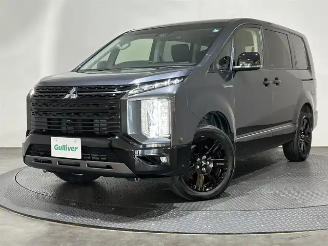 三菱 デリカＤ：５ シャモニー 愛媛県 2023(令5)年 1.1万km グラファイトグレーメタリック/ブラックマイカ ・１１型ナビ/（フルセグＴＶ・ＢＴ・ＣＤ・ＤＶＤ・ＦＭ・ＡＭ・ＵＳＢ・ＨＤＭＩ）/・全方位カメラ　/・ＥＴＣ　/・レーダークルーズコントロール　/・１２．８型後席モニター　/・衝突軽減ブレーキ　/・レーンキープアシスト/・パドルシフト/・DN席シートヒーター/・D席パワーシート/・両側電動ドア/・ステアリングヒーター/・パワーバックドア/・オートマチックハイビーム/・LEDヘッドライト