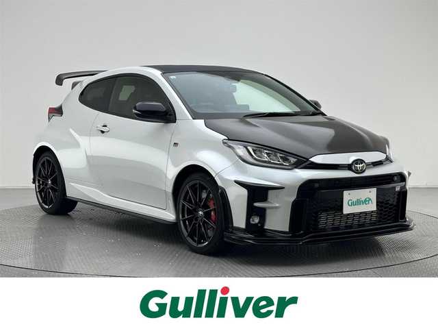 トヨタ ＧＲヤリス RZ ハイパフォーマンス 兵庫県 2021(令3)年 2万km プラチナホワイトパールマイカ ・純正ディスプレイオーディオ/・バックカメラ/・フルセグTV/・ETC/・JBLサウンド/・6速MT/・純正18インチアルミホイール/・衝突軽減ブレーキ/・レーンキープアシスト/・追従クルーズコントロール/・BSM/・ヘッドアップディスプレイ/・アイドリングストップ/・LEDヘッドライト/・LEDフォグランプ/・オートライト/・オートハイビーム/・コーナーセンサー/・社外リアウイング/・社外ボンネット(純正ボンネット積み込み)/・スマートキー/・スペアキー1本/・プッシュスタート