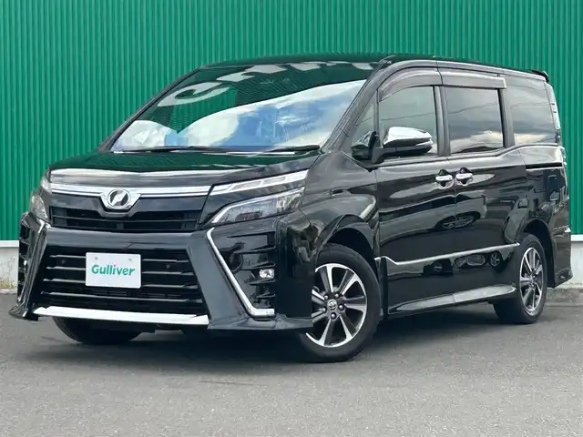 トヨタ ヴォクシー ZS 煌Ⅱ 宮城県 2019(令1)年 4.4万km ブラック セーフティセンス/・プリクラッシュセーフティ/・レーンディパーチャーアラート/・オートマチックハイビーム/・先行車発進告知/インテリジェントクリアランスソナー/純正フリップダウンモニター（V12T-R68C）/純正10インチナビ（NSZN-Z68T）ナビSD後日送付の為動作未確認/・CD/DVD/・Bluetooth/・フルセグTV/・SD音楽録音機能/バックカメラ/ドライブレコーダー/ビルトインETC/両側パワースライドドア/シートカバー/革巻きステアリング/クルーズコントロール/ステアリングスイッチ/MTモード付AT/LEDヘッドライト/フォグランプ/オートライト/スマートキー＆プッシュスタート/電動格納ミラー/純正16インチAW/フロアマット/ドアバイザー/Wエアバッグ