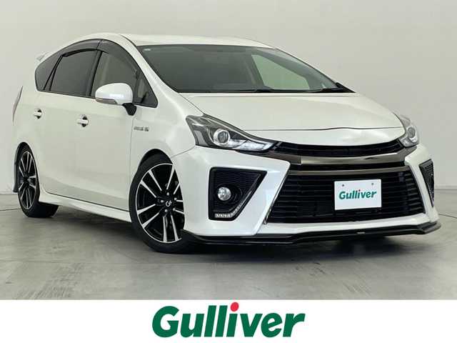 トヨタ プリウス α S ツーリングセレクション G’s 群馬県 2016(平28)年 7万km ホワイトパールクリスタルシャイン 寒冷地仕様/・ウィンドシールデアイサー/・ヒーター付ドアミラー/・リヤフォグランプ/＝＝＝＝＝/ALPINE10インチフリップダウンモニター/Strada7インチナビ/・AM/FM/CD/DVD/SD/Bluetooth/フルセグTV/バックカメラ/SilkBLazeエアロ/ROWENマフラー/ESPELIRダウンサスペンション/純正ビルトインETC/プッシュスタート/スマートキー/ハーフレザーシート