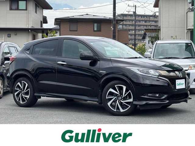 ホンダ ヴェゼル ハイブリッド RS ホンダセンシング 静岡県 2017(平29)年 4.4万km クリスタルブラックパール エンジンスタートボタン/パワーステアリング/パワーウィンドウ/アイドリングストップ/パドルシフト/スマートキー/オートエアコン/クルーズコントロール/バックカメラ/純正ナビ（CD/DVD/BT/フルセグ）/ドライブレコーダー前後/純正フロアマット/ハーフレザー/D席N席シートヒーター/純正アルミホイール/ABS/横滑り防止装置/レーンキープアシスト/オートライト/LEDヘッドライト/W＋サイドエアバック/衝突軽減システム/カーテンエアバック