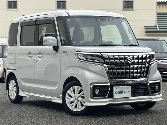 スズキ スペーシア カスタム HYBRID GS 大阪府 2023(令5)年 1.2万km ピュアホワイトP ワンオーナー/セーフティサポート（予防安全技術）/・デュアルカメラブレーキサポート/・誤発進抑制機能/・車線逸脱警報機能/・ふらつき警報機能/・先行車発進お知らせ機能/・ハイビームアシスト/・アダプティブクルーズコントロール/・後退時ブレーキサポート/・後方誤発進抑制/・リアパーキングアシスト/7型ディスプレイオーディオ（FH-8500DVS)/・Bluetooth接続/・AndroidAuto/・CD/DVD/前後ドライブレコーダー（ZDR-035)/片側パワースライドドア/LEDヘッドランプ/シートヒーター/横滑り防止機能/USB充電ポイント/純正エアロパーツ（サイド/リアスポイラー）/純正AW（14inch)/純正フロアマット/フォグランプ/ドアバイザー/ステアリングスイッチ/取扱説明書/保証書