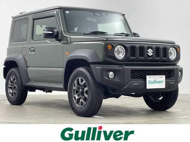 スズキ ジムニー シエラ JC 鹿児島県 2025(令7)年 0.4万km ジャングルグリーン ワンオーナー/社外ディスプレイオーディオ/バックカメラ/前後ドライブレコーダー/衝突軽減ブレーキ/車線逸脱警報/ヒルディセントコントロール/クルーズコントロール/ＥＴＣ/シートヒーター/スマートキー/純正フロアマット/保証書/取扱説明書