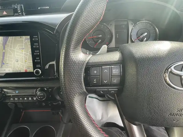トヨタ ハイラックス Z GRスポーツ 福岡県 2023(令5)年 3.1万km スーパーホワイトⅡ 純正8インチディスプレイオーディオ(AM/FM/BT/Miracast)/全方位カメラ/コーナーセンサー/レーダークルコン/パドルシフト/ETC/前後ドラレコ/DAC/ベッドライナー/サイドステップ/トノカバー/バグガード/GRマッドフラップ/USBポート/純正18インチアルミホイール/スマートキー/プッシュスタート