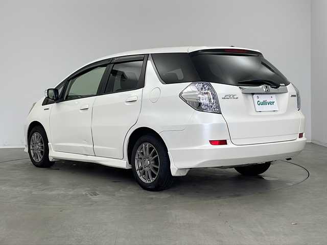 ホンダ フィット シャトル ハイブリッド 新潟県 2012(平24)年 14.7万km プレミアムホワイトパール 社外ナビ（CN-MW240D)/バックカメラ/前後ドライブレコーダー/ビルトインETC/クルーズコントロール/ハーフレザーシート/オートライト/フォグランプ/社外15インチアルミホイール