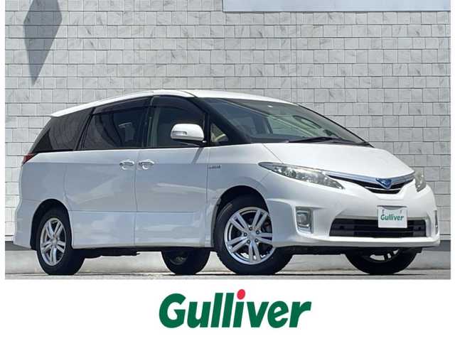 トヨタ エスティマ ハイブリッド X 岩手県 2014(平26)年 4.6万km パール 禁煙車/4WD/AC100V電源/片側パワースライドドア/イージークローザードア/純正ナビ/→Bluetooth/CD/DVD/ワンセグTV/FM/AM/バックカメラ/ステアリングスイッチ（ナビ連動）/クルーズコントロール/前後ドライブレコーダー/〇電装格納ミラー/〇ウィンカーミラー/〇ドアバイザー/〇フロアマット/〇プッシュスタート/オートライト/フォグライト/スペアキー/社外アルミホイール