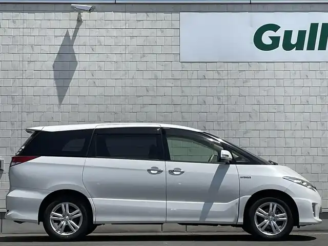 トヨタ エスティマ ハイブリッド X 岩手県 2014(平26)年 4.6万km パール 禁煙車/4WD/AC100V電源/片側パワースライドドア/イージークローザードア/純正ナビ/→Bluetooth/CD/DVD/ワンセグTV/FM/AM/バックカメラ/ステアリングスイッチ（ナビ連動）/クルーズコントロール/前後ドライブレコーダー/〇電装格納ミラー/〇ウィンカーミラー/〇ドアバイザー/〇フロアマット/〇プッシュスタート/オートライト/フォグライト/スペアキー/社外アルミホイール