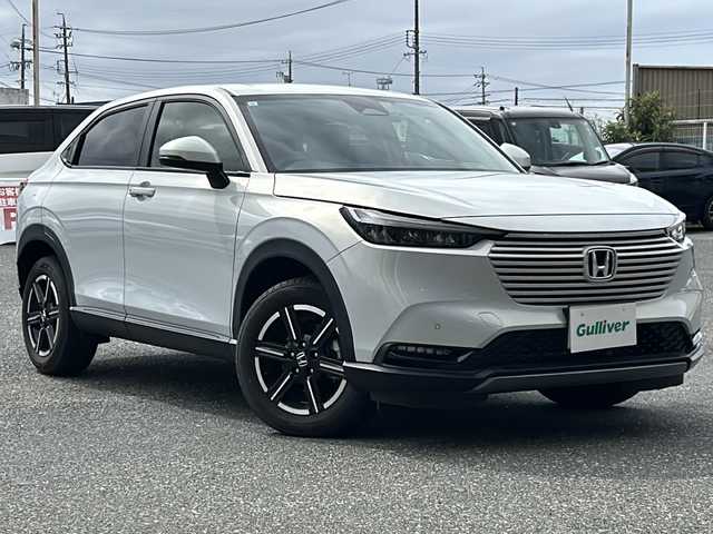 ホンダ ヴェゼル G 愛知県 2022(令4)年 1.7万km プレミアムサンライトホワイトパール 登録時走行距離16200km/純正9インチメモリナビ/(Bluetooth/フルセグTV/USB)/バックカメラ/ドラレコ前後/コーナーセンサー/ワイヤレス充電器/ホンダセンシング/衝突軽減アシスト/誤発信抑制機能/先行車発進告知/ロードサインアシスト/アダプティブクルーズコントロール/レーンキープアシスト/ビルドイン2.0ETC/電動パーキングブレーキ/オートホールド/ヘッドランプレベライザー/左側サイドアンダーミラー/スマートキー/(スペアキー×1)/取説/保証書