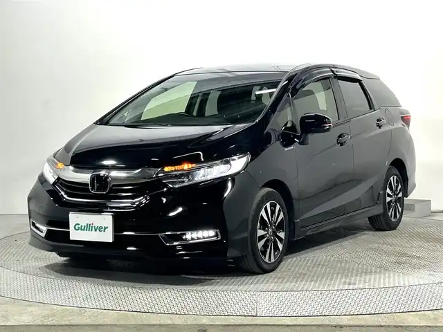 ホンダ シャトル ハイブリッド X ホンダセンシング 大阪府 2019(令1)年 3.9万km クリスタルブラックパール 社外ナビ(フルセグ/DVD再生/Bluetooth) バックカメラ ETC 衝突軽減 レーダークルコン レーンアシスト ハーフレザー シートヒーター パドルシフト スマートキー Pスタート