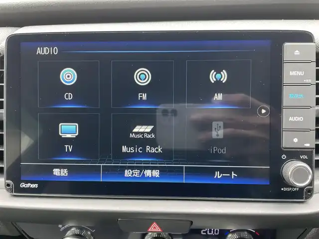 ホンダ フィット e:HEVクロスター 福岡県 2021(令3)年 1.2万km サーフブルー レーンキープアシスト/横滑り防止装置/エアバッグ(W＋サイド)/カーテンエアバッグ/ABS/パーキングアシスト/前後コーナーセンサー/バックカメラ/Gathersナビ(BT/CD/iPod/AUX/AMFM/フルセグ)/クルーズコントロール(追従あり)/オートライト/純正アルミホイール/純正フロアマット/スマートキー/ワンオーナー