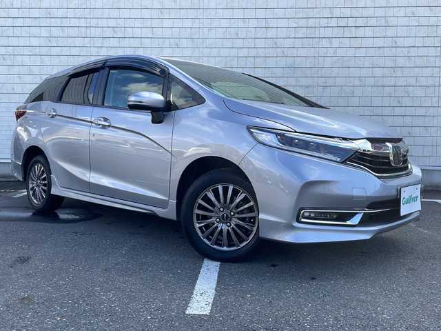 ホンダ シャトル G ホンダセンシング 秋田県 2022(令4)年 2.7万km ルナシルバーM ・4WD/・ボタンスターター/・純正ナビ/・TV/・CD/・DVD/・Bluetooth/・バックモニター/・パワーウィンドウ/・フルフラットシート/・AAC/・アイドリングストップ/・ABS/・横滑り防止装置/・レーンキープアシスト/・オートライト/・衝突軽減システム