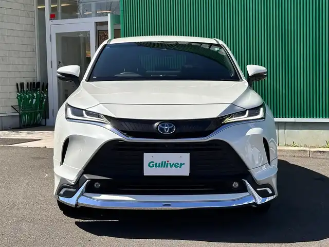 トヨタ ハリアー ハイブリッド Z 宮城県 2021(令3)年 5.5万km ホワイトパールクリスタルシャイン モデリスタエアロ（F/S/R）/セーフティセンス/・プリクラッシュセーフティ/・レーントレーシングアシスト/・レーダークルーズコントロール/・アダプティブハイビームシステム/・ロードサインアシスト/ブラインドスポットモニター/パーキングサポートブレーキ（前後方静止物/後方接近車両）/デジタルインナーミラー/カラーヘッドアップディスプレイ/TコネクトSDナビゲーションシステム/・12.3インチディスプレイ/・SDナビ/・Bluetooth/・AppleCarPlay/AndroidAuto/・フルセグTV/パノラミックビューモニター/ビルトインETC2.0/ハンズフリーパワーバックドア/ハーフレザーシート/パワーシート/革巻きステアリング/ステアリングスイッチ/電動パーキングブレーキ/ブレーキホールド/LEDヘッドランプ/フォグランプ/オートライト/スマートキー＆プッシュスタート/スペアキー/電動格納ミラー/純正19インチAW/純正フロアマット/W/サイド/カーテンエアバッグ