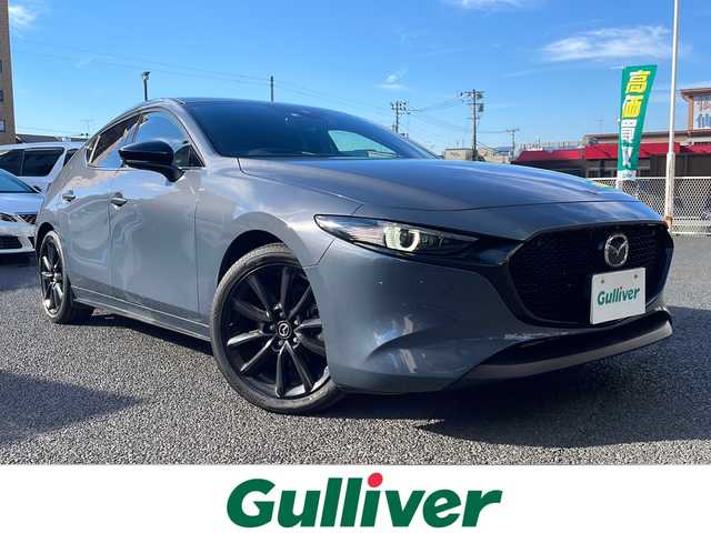 マツダ マツダ３ファストバック 20S ブラックトーンED 山形県 2022(令4)年 2.1万km ポリメタルグレーM ・ワンオーナー/・純正ナビ（SDカード無し）/フルセグ/CD/DVD/Bluetooth/・全方位カメラ/・純正前後ドラレコ/・ビルトインETC/・レーダークルーズコントロール/・レーンキープアシスト/・衝突被害軽減ブレーキ/・ブラインドスポットモニタリング/・前後クリアランスソナー/・LEDヘッドランプ/・オートマチックハイビーム/・ヘッドアップディスプレイ/・パドルシフト/・純正AW/・純正マット/・純正エンジンスターター/・社外AW＋スタッドレスタイヤ車載/・スペアキー1本/・保証書/・取扱説明書