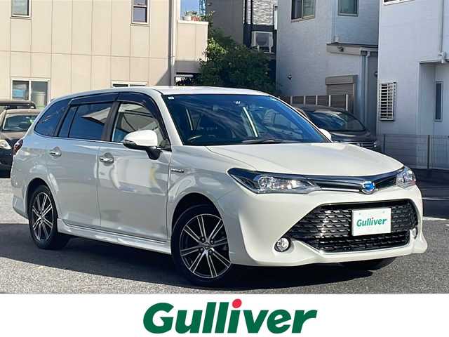 トヨタ カローラ フィールダー ハイブリッドG ダブルバイビー 愛知県 2017(平29)年 5.7万km ホワイトパールクリスタルシャイン /ワンオーナー//禁煙車//ストラーダナビ（CN-RE03WD）//AM・FM・Bluetooth・DVD・CD//フルセグTV//バックカメラ//プッシュスタート//ETC//ＬＥＤヘッドライト・オートライト//前方ドライブレコーダー（DRY-STE3000)//純正16インチホイール//スペアキー（1本）//電動格納ミラー//横滑り防止//車線逸脱警報//運転モード（EC・EV)//ブレーキアシスト//衝突安全ボディー//EBD（電力制御制動力配分システム）//VSC（ビークルスタビリティコントロール）//TRC（トラクションコントロールシステム）//UVカットガラス//プライバシーガラス//アイドリングストップ//保証証//取扱説明書//記録簿