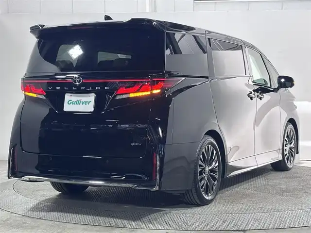 トヨタ ヴェルファイア ハイブリット Z プレミア 大阪府 2025(令7)年 0.6万km ブラック ガラスルーフ　ユニバーサルステップ　純正ナビ　全周囲カメラ　BT フルセグTV 純正フリップダウンモニター　パーキングアシスト　デジタルインナーミラー　両側パワースライドドア　パワーシート　シートヒーター　エアーシート　パワーバックドア　クリアランスソナー ETC　オートライト　LEDヘッドライト
