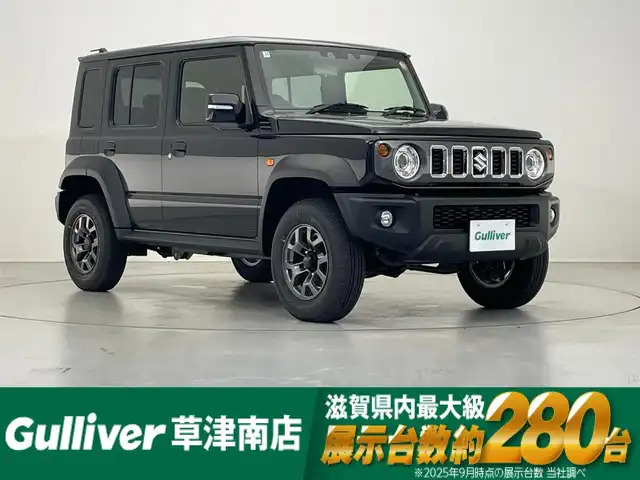 スズキ ジムニー ノマド FC 滋賀県 2025(令7)年 0.1千km 黒 追従クルーズコントロール/リアソナー/衝突軽減ブレーキ/LEDヘッドライト/オートマチックハイビーム/ヒルディセントコントロール/D/Nシートヒーター/純正フロアマット/プッシュスタート/スマートキー/ステアリングリモコン
