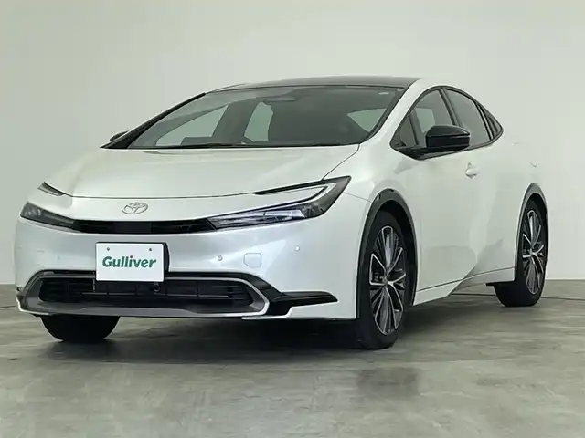 トヨタ プリウス Z 群馬県 2024(令6)年 1.1万km プラチナホワイトパールマイカ １２．３型ＤＡ（フルセグ/BT/Miracast/USB）/ガラスルーフ/全方位カメラ/衝突軽減/パーキングアシスト/ＢＳＭ/レーダークルーズ/ＰＷバックドア/メモリー付ＰＷシート/エアーシート/シートヒーター/１００Ｖ電源/ＥＴＣ２．０/前後ドラレコ/デジタルインナーミラー/前後コーナーセンサー/LEDヘッド/純正アルミ/禁煙車