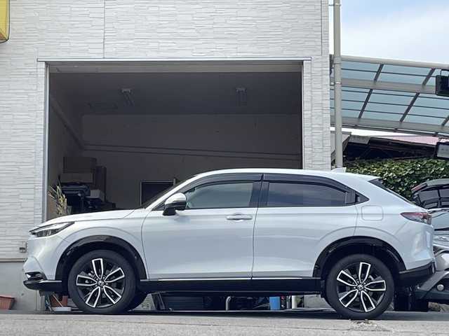 ホンダ ヴェゼル ハイブリッド e:HEV Z 大分県 2023(令5)年 2.5万km プレミアムサンライトホワイトパール ワンオーナー /ハーフレザーシート /全方位カメラ/おくだけ充電/デジタルインナーミラー/パワーバックドア/純正ナビ/フルセグTV/Bluetooth/純正フロアマット/純正18インチアルミホイール/純正ETC/純正ドラレコ/純正LEDヘッドライト/オートライト/衝突被害軽減ブレーキ/横滑り防止装置/レーンキープアシスト/コーナーセンサー