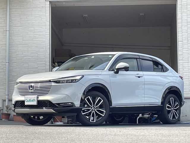 ホンダ ヴェゼル ハイブリッド e:HEV Z 大分県 2023(令5)年 2.5万km プレミアムサンライトホワイトパール ワンオーナー /ハーフレザーシート /全方位カメラ/おくだけ充電/デジタルインナーミラー/パワーバックドア/純正ナビ/フルセグTV/Bluetooth/純正フロアマット/純正18インチアルミホイール/純正ETC/純正ドラレコ/純正LEDヘッドライト/オートライト/衝突被害軽減ブレーキ/横滑り防止装置/レーンキープアシスト/コーナーセンサー