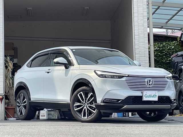 ホンダ ヴェゼル ハイブリッド e:HEV Z 大分県 2023(令5)年 2.5万km プレミアムサンライトホワイトパール ワンオーナー /ハーフレザーシート /全方位カメラ/おくだけ充電/デジタルインナーミラー/パワーバックドア/純正ナビ/フルセグTV/Bluetooth/純正フロアマット/純正18インチアルミホイール/純正ETC/純正ドラレコ/純正LEDヘッドライト/オートライト/衝突被害軽減ブレーキ/横滑り防止装置/レーンキープアシスト/コーナーセンサー